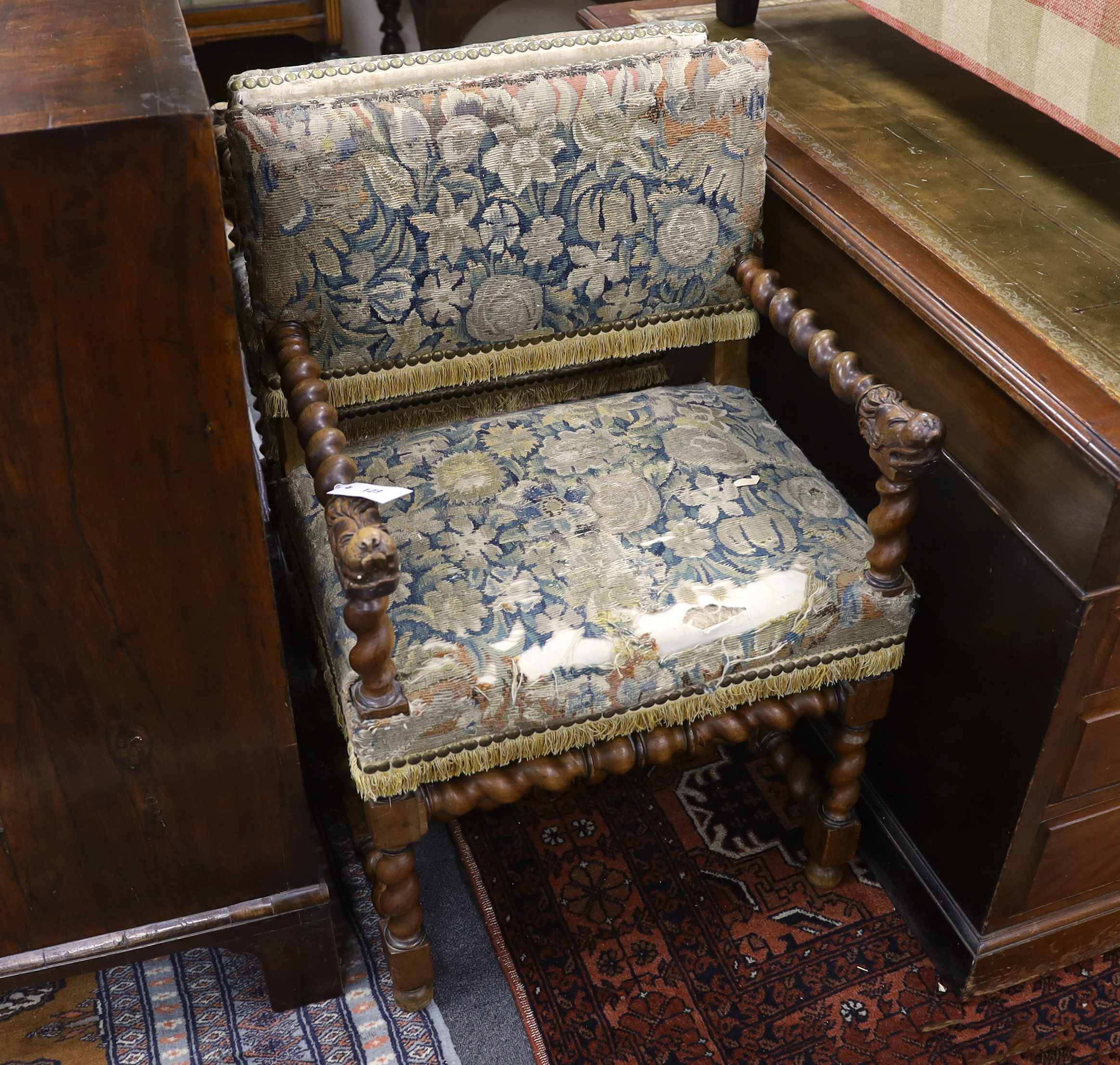 A pair of Louis XIII walnut fauteuils, recovered with 17th/18th century verdure tapestry to the seats and backs., Provenance – Sotheby’s, Paris, European Private collection sale, 16th April 2003, lot number 51